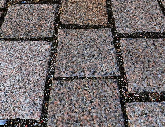 Close up view of different perspective on cobblestone ground surfaces taken on historical streets