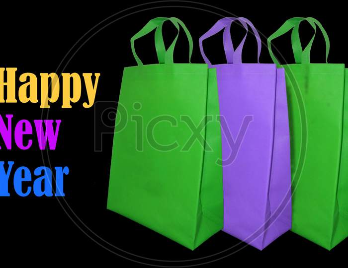 Shopping Bags Over an Isolated Background With New Year Wishes For  Commercial Purpose