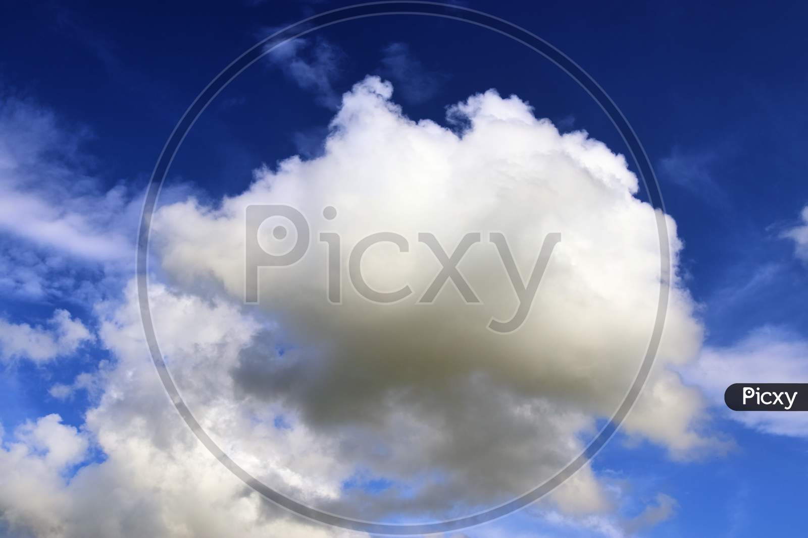Dramatic Sky With White Cotton Clouds Over Blue Sky As Background