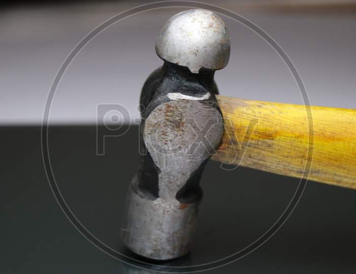 Image of Vintage Hammer Which Has A Crack On Its Wooden Handle