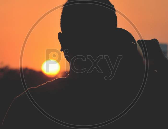 Silhouette Of Photographer
