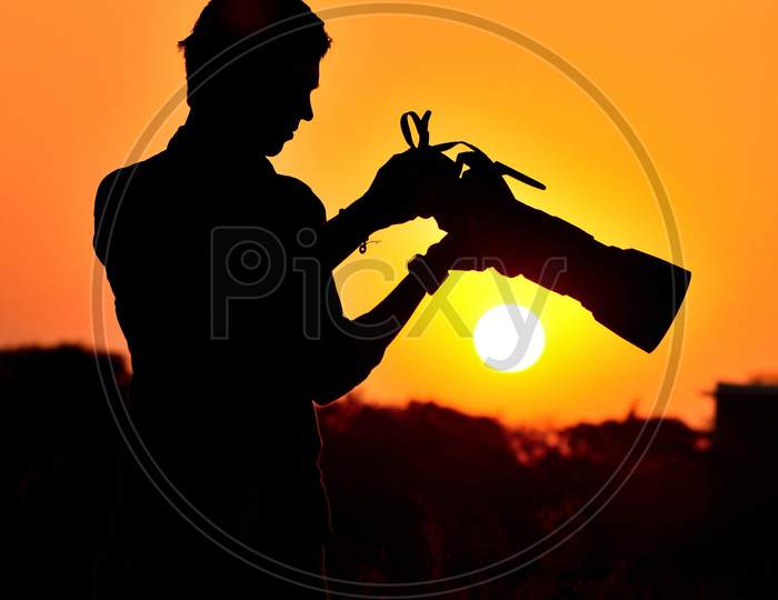Silhouette Of Photographer