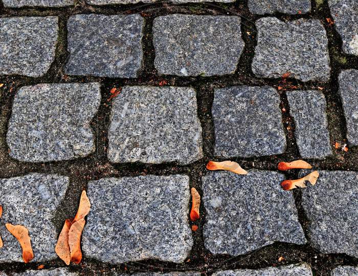 Close up view of different perspective on cobblestone ground surfaces taken on historical streets