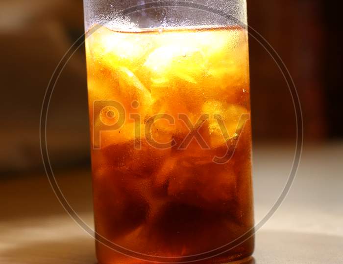 Cold Drink In A Glass With Ice Cubes
