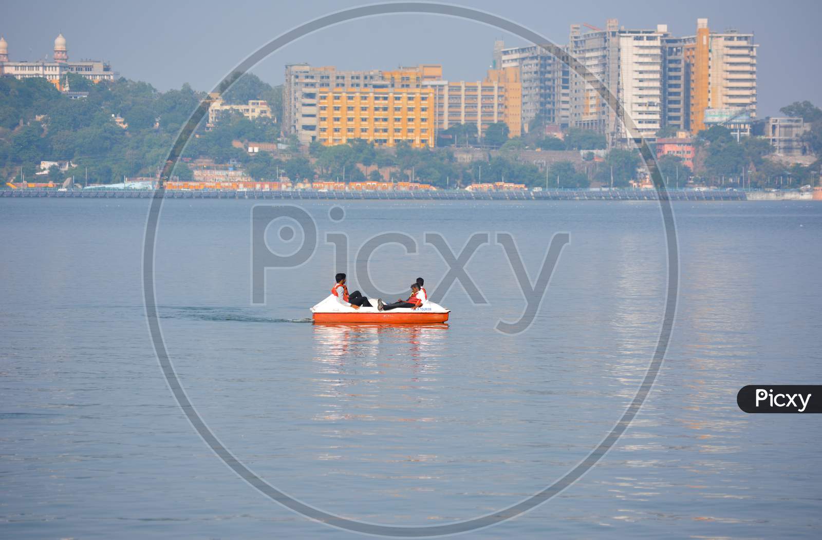 BHOPAL, MADHYA PRADESH, INDIA - NOVEMBER 20, 2019: Unidentified people riding boat during summer vacation in bhopal, Madhya Pradesh, India. Travel concept. Happy vacation.