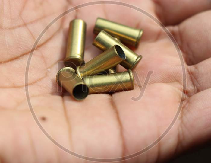 Group Of Used Bullet Shells From A Revolver
