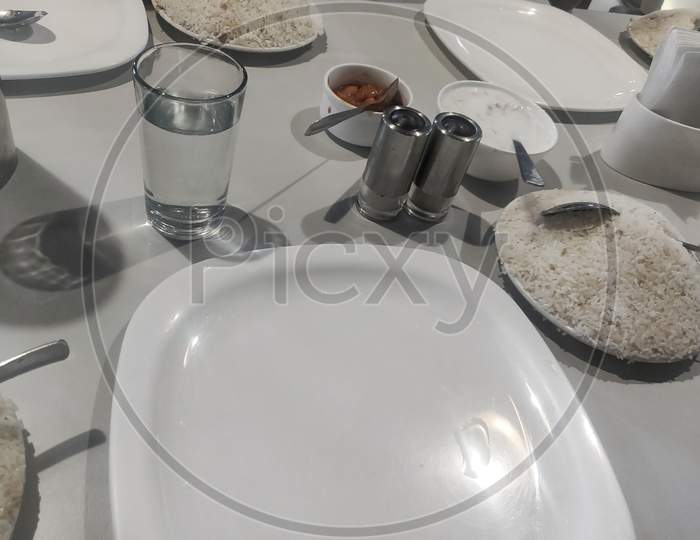 Culinary Set On A Table With Food (Rice And Pickle).