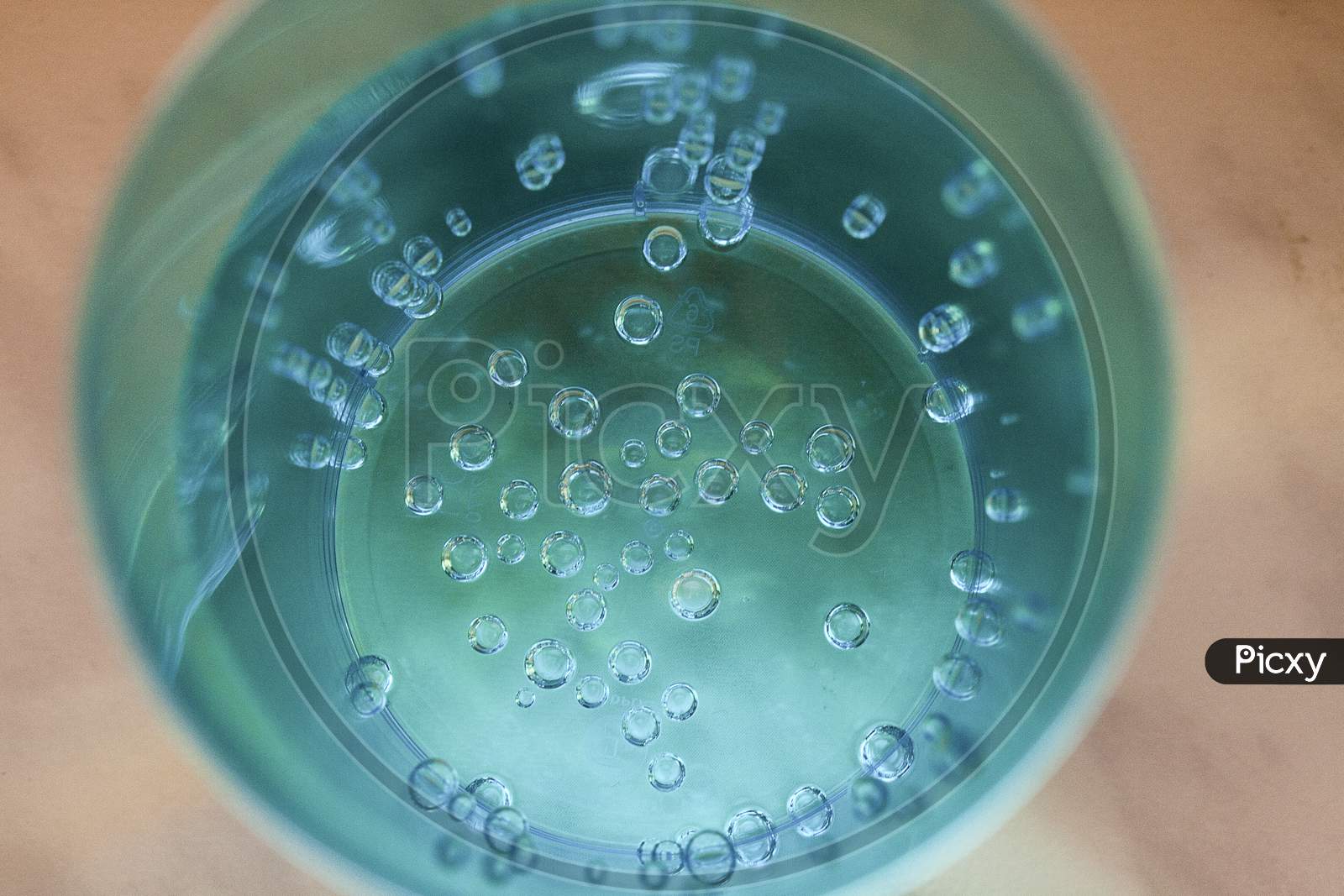 Close Up Bubbles In A Turquoise Glass
