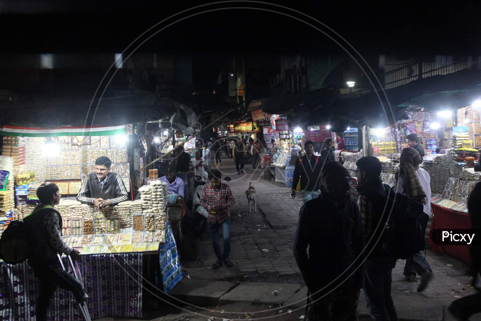 People shopping in a market during Night