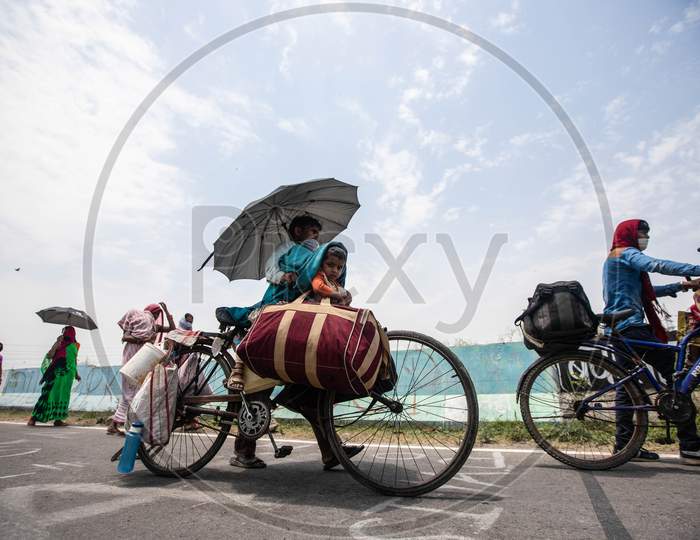 Migrant Worker Kamlesh  Peddling Back To His Village In Sagar District Of Madhya Pradesh With His Children Anushka 7, And Krishna, 4, In New Delhi, India, On May 11, 2020.Distance Between New Delhi To Sagar Is Approximately 680 Kilometres.