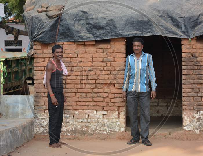 TIKAMGARH, MADHYA PRADESH, INDIA - NOVEMBER 15, 2019: Two Indian rural farmer looking at the camera.