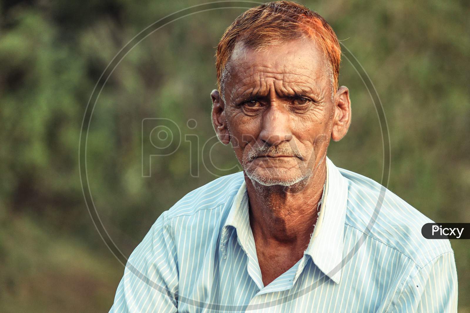 Almora, Uttrakhand, India- May 22 2020: A Travel Portrait Of An Old Person Looking Into The Camera, Wrinkles All Over The Face And Red Hair.