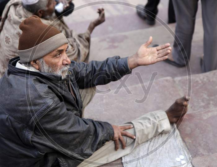 An Old Man asking for donations