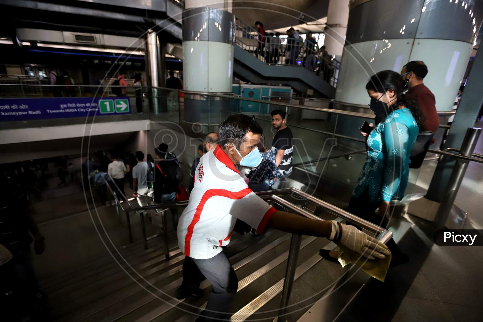Delhi Metro Started Sanitation Drive As A Preventive Measure Against The Covid-19 Novel Coronavirus Walks Out Of A Metro Station In New Delhi On March 13, 2020.