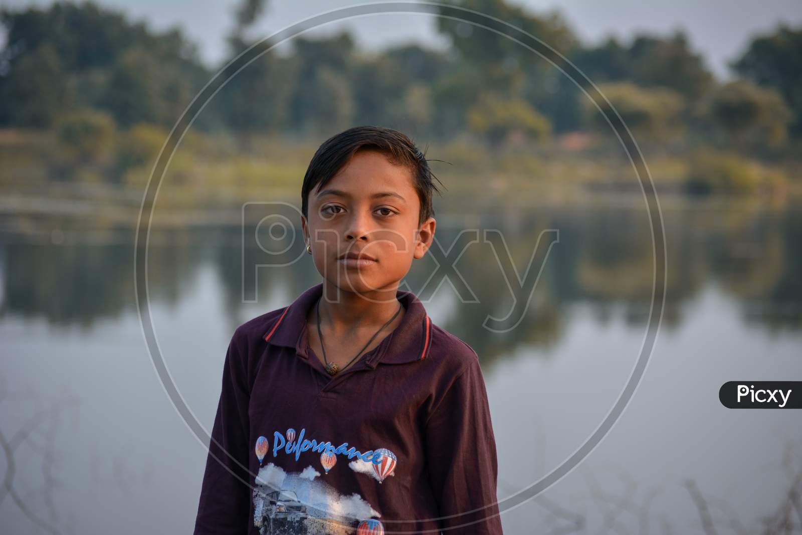 TIKAMGARH, MADHYA PRADESH, INDIA - NOVEMBER 13, 2019: Indian kid looking curious into the camera.