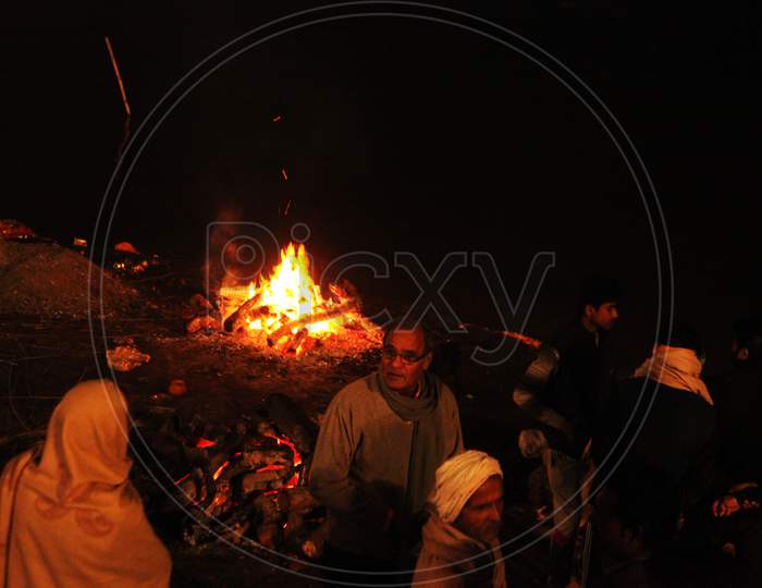 People near a Fire in Varanasi