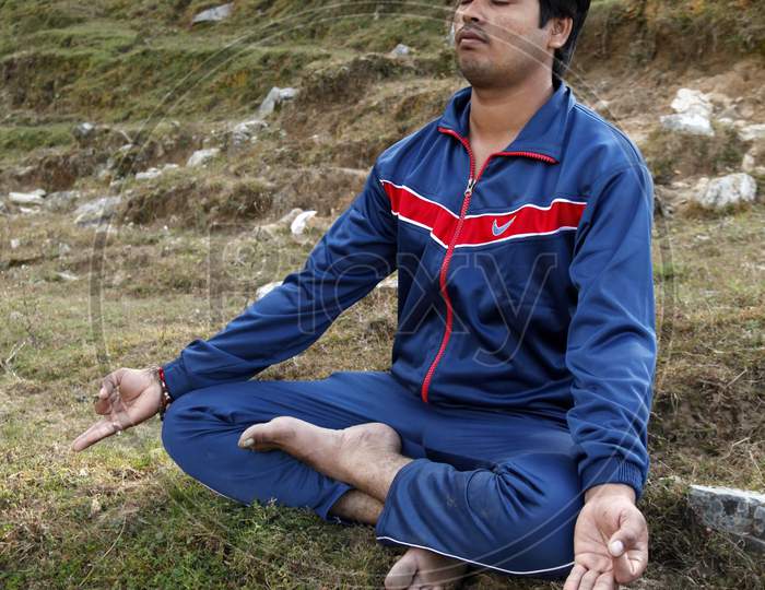 Portrait of a Young Indian Man doing Meditation