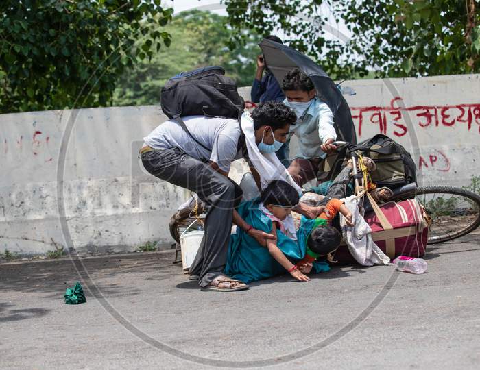 Migrant Worker Kamlesh Lost His Balance While Peddling Back To His Village In Sagar District Of Madhya Pradesh With His Children Anushka 7, And Krishna, 4, In New Delhi, India, On May 11, 2020.Distance Between New Delhi To Sagar Is Approximately 680 Kilometres.