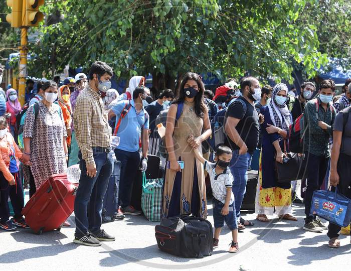 People Wait In A Queue Outside The Railway Station To Board The Train For Home, After The Government Eased Lockdown, At New Delhi Railway Station, On May 12, 2020 In New Delhi, India.
