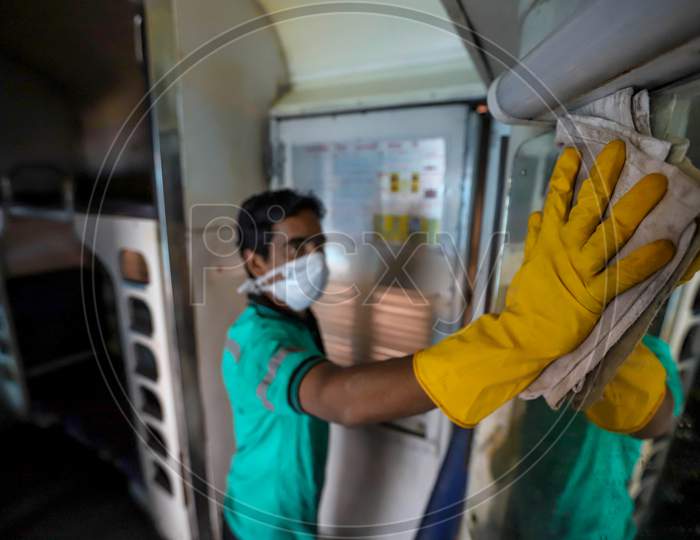 Indian Railway Worker Cleans  The Rail Coach As A Preventive Measure Against The Covid-19 Novel Coronavirus  In New Delhi On March 13, 2020.