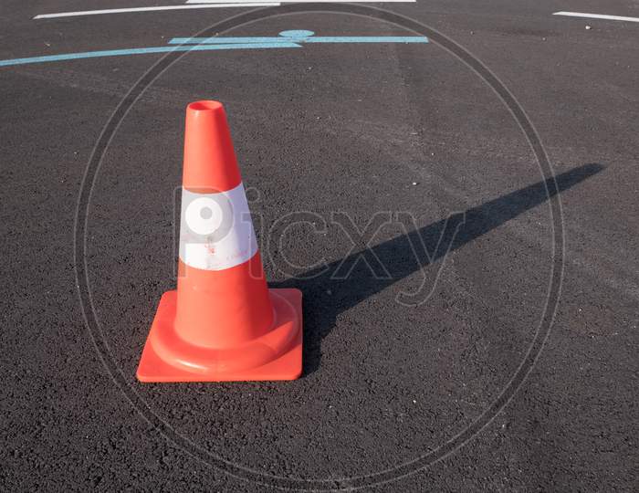 Traffic Cone With Shadow On Asphalt