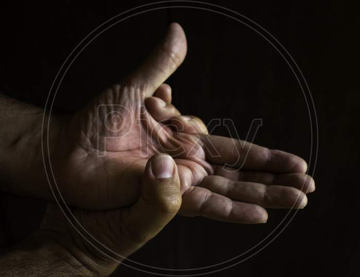 Adult Man With Pain In His Hands. Automassage Of Hands. Inflammatory Disease Concept.