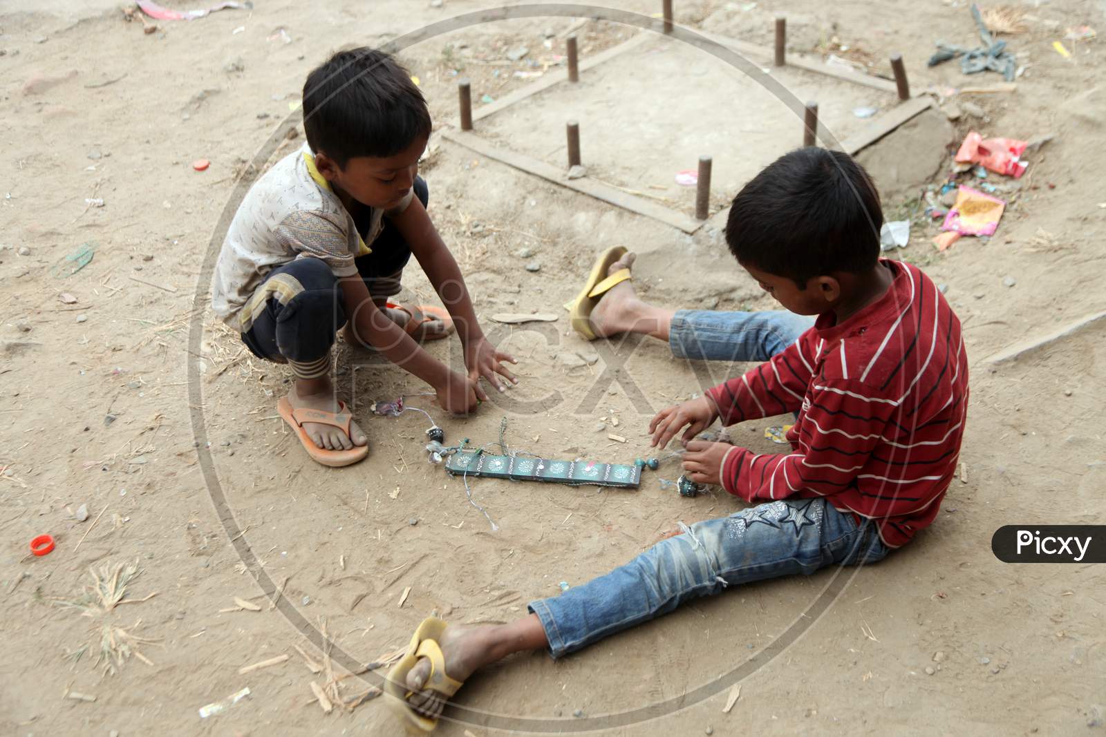 Photograph of Rural kids sitting on Ground