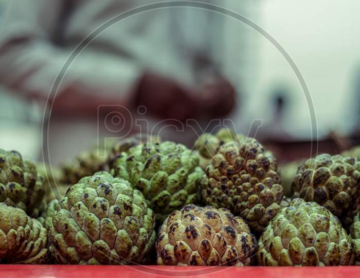 Stacks Of Sugar Apple Or Custard Apple At The Traditional Marketplace In Delhi