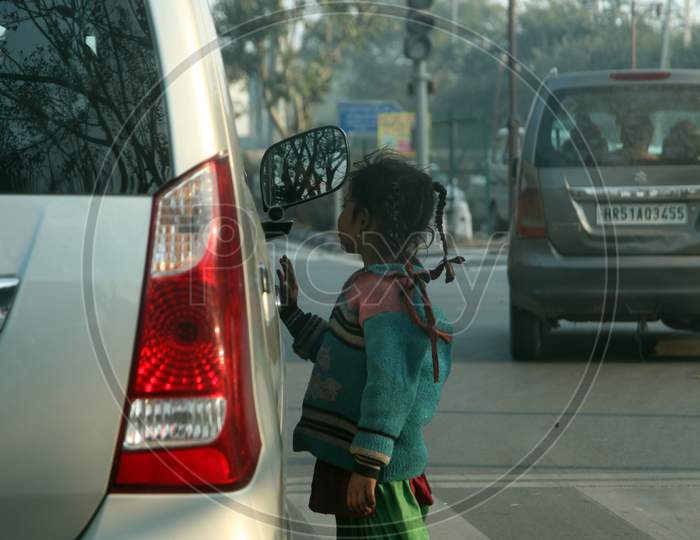 A Rural Kid asking for donations on the road