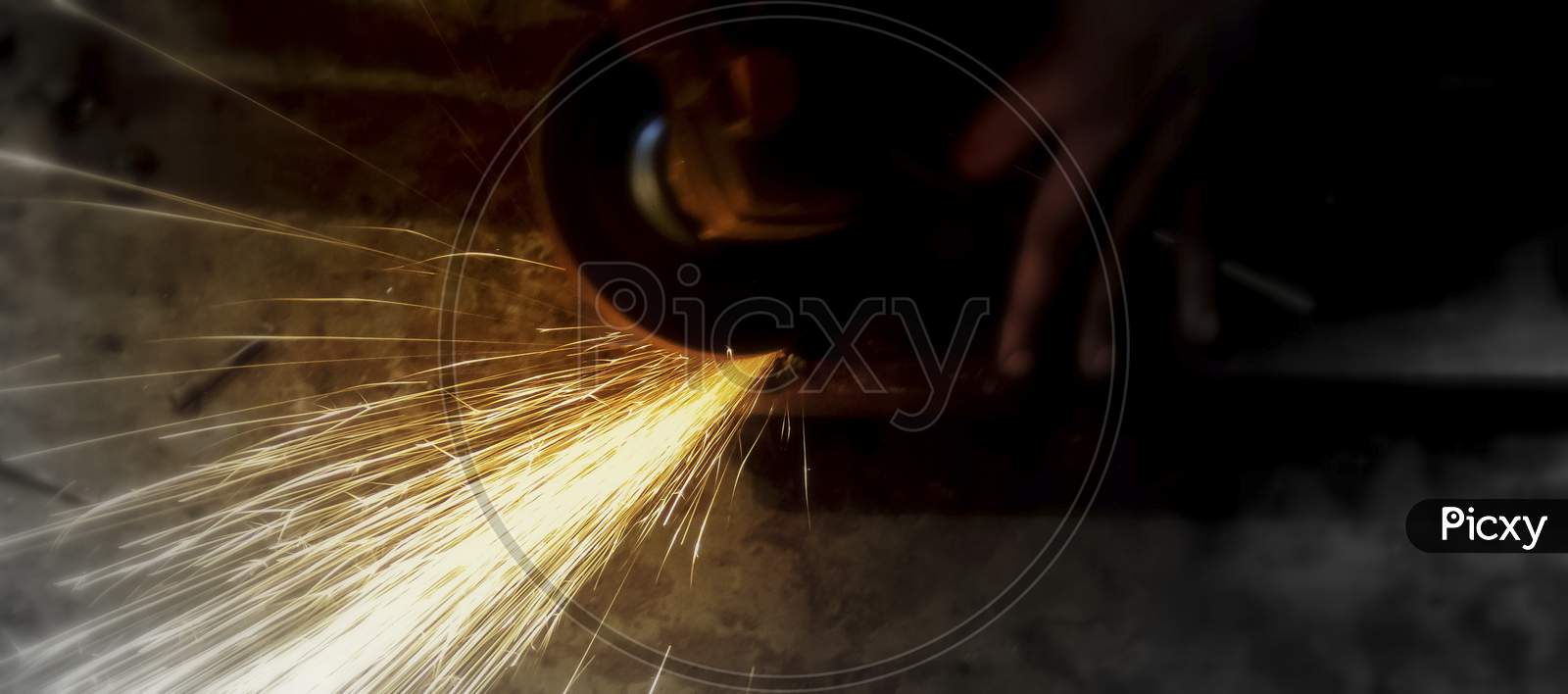 Sparks Flying While Machine Griding And Finishing Metal.Selective Focus.