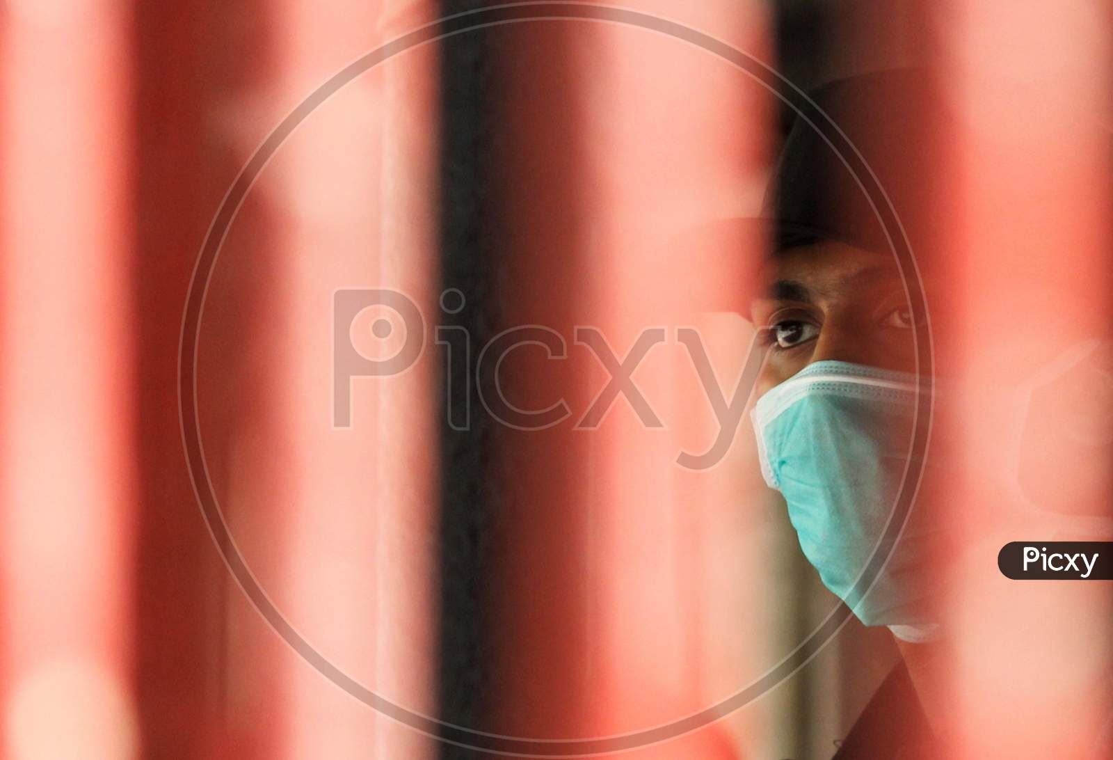 A security guard is seen wearing a protective mask inside a hospital premise where a special ward has been set up for the coronavirus disease in Mumbai, India on March 5, 2020.