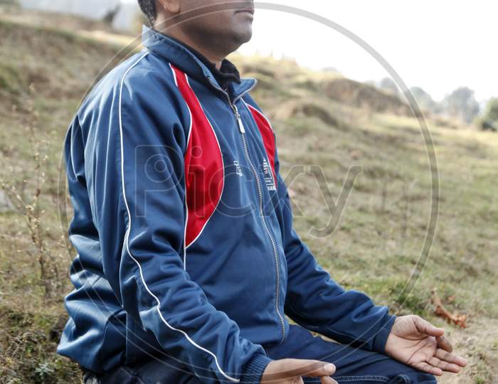 A Young Indian Man doing Meditation
