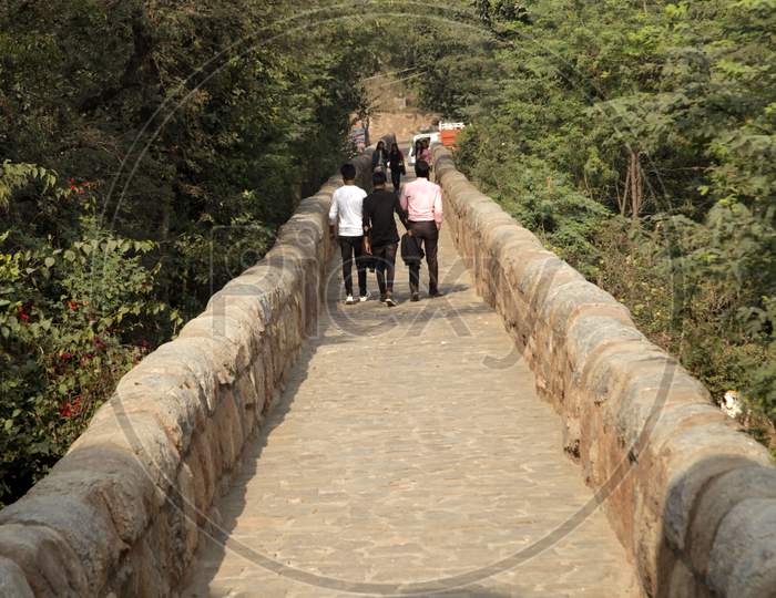 People Exploring Tughlakabad Fort in New Delhi