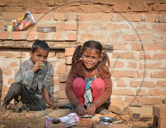 TIKAMGARH, MADHYA PRADESH, INDIA - NOVEMBER 15, 2019: Unidentified indian children looking curious into the camera.