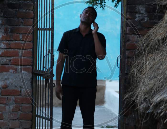 A Young Man talking in Phone
