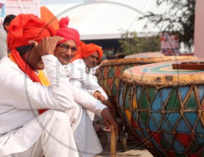 Group of People with Dhol Paan