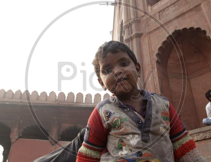 Portrait of an Indian Rural Kid in Jama Masjid
