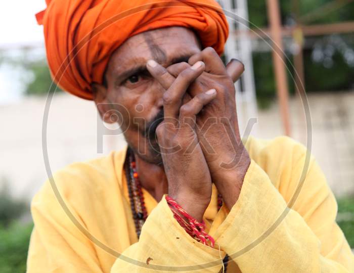 Portrait of an Indian Hindu Sadhu or Baba Smoking Chillam