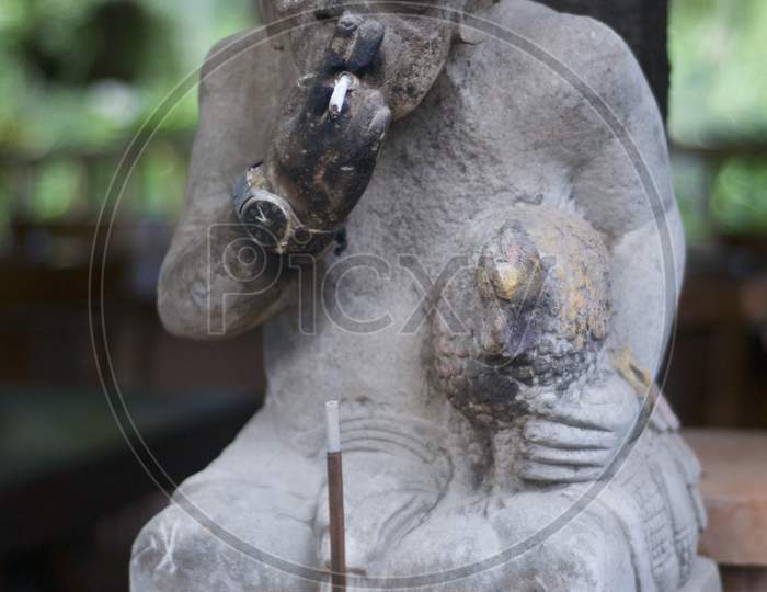 Smoking Balinese Stone Statue