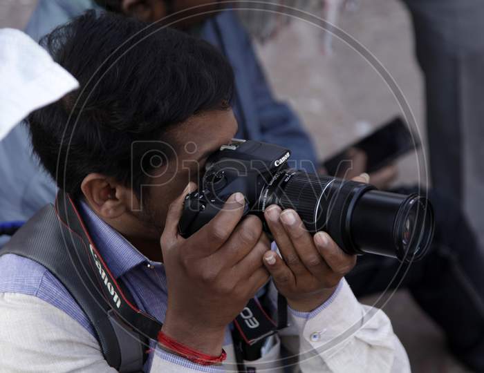 A Photographer clicking Photos in Jama Masjid New Delhi
