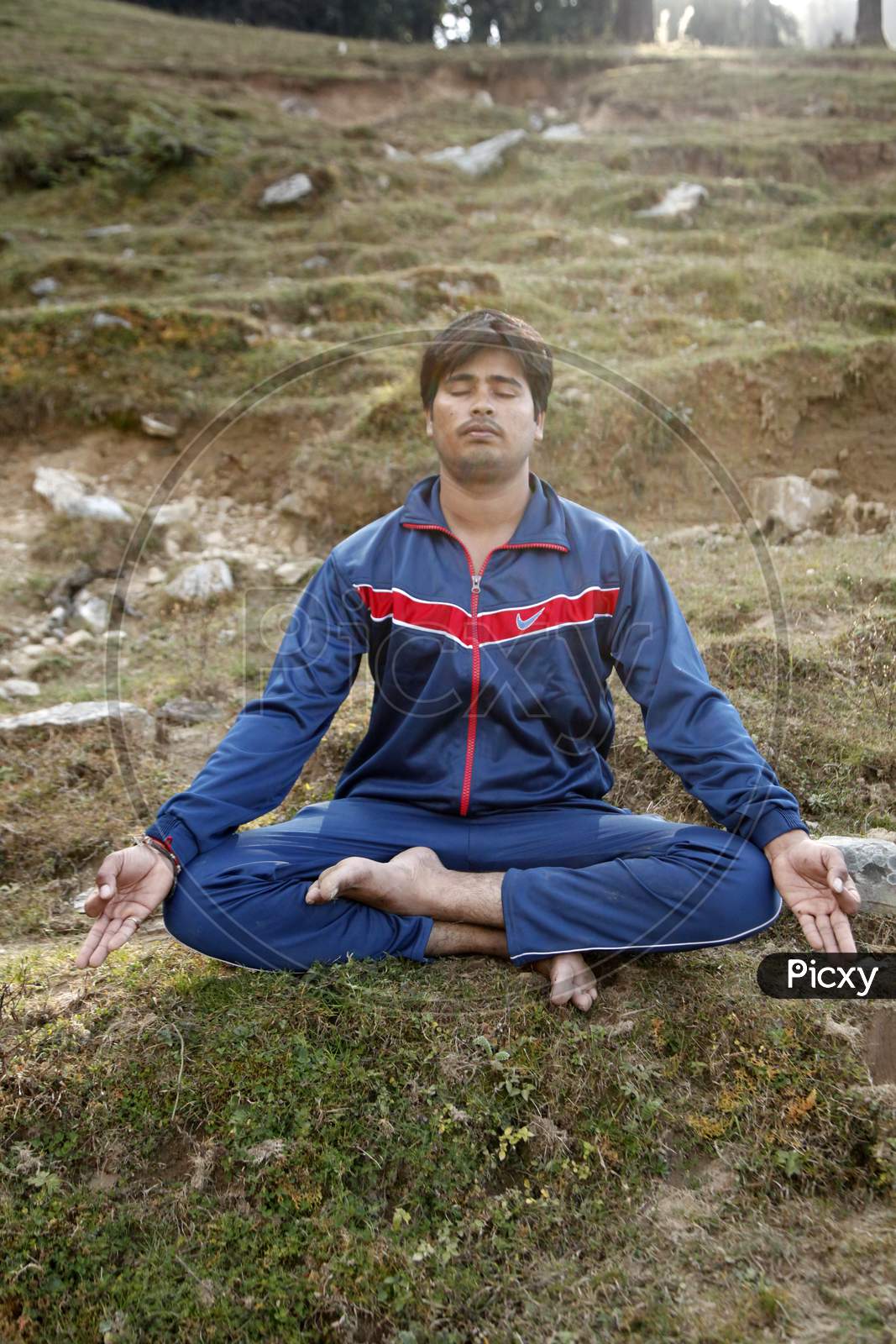 A Young Indian Man doing Meditation