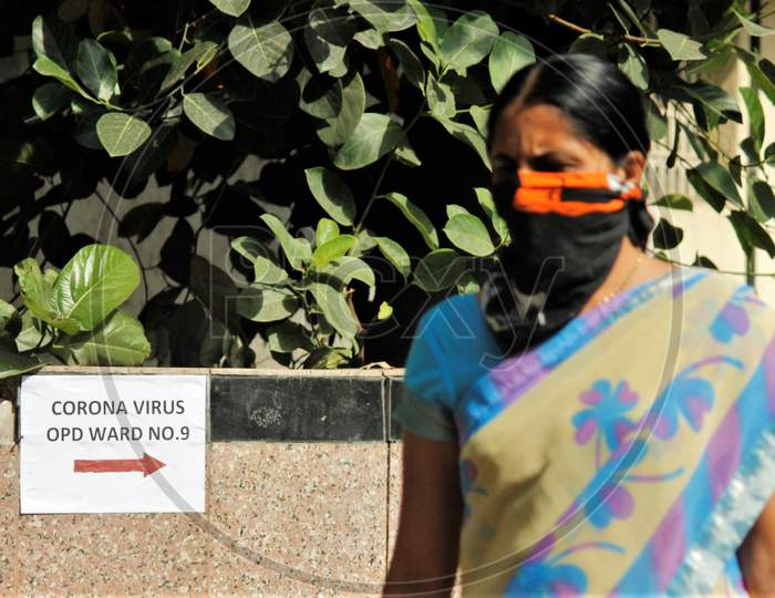 A woman is seen wearing a protective mask inside a hospital premise where a special ward has been set up for the coronavirus patients in Mumbai, India on March 5, 2020.
