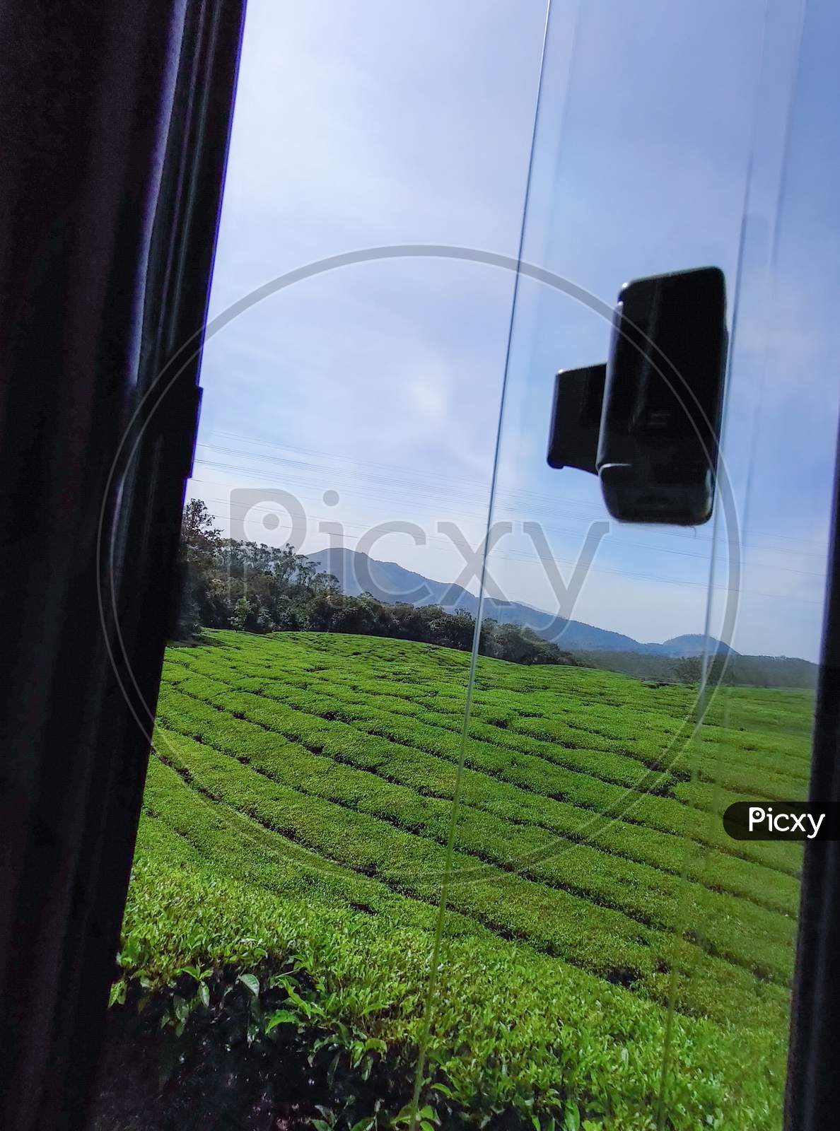 View of a Hill station on open Bus window