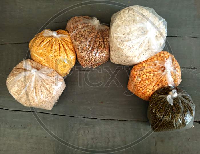 Lentils assorted packets and puffed rice packet on a table.