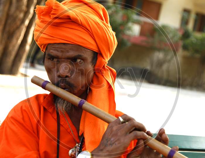 Portrait of an Indian Hindu Sadhu or Baba with Flute