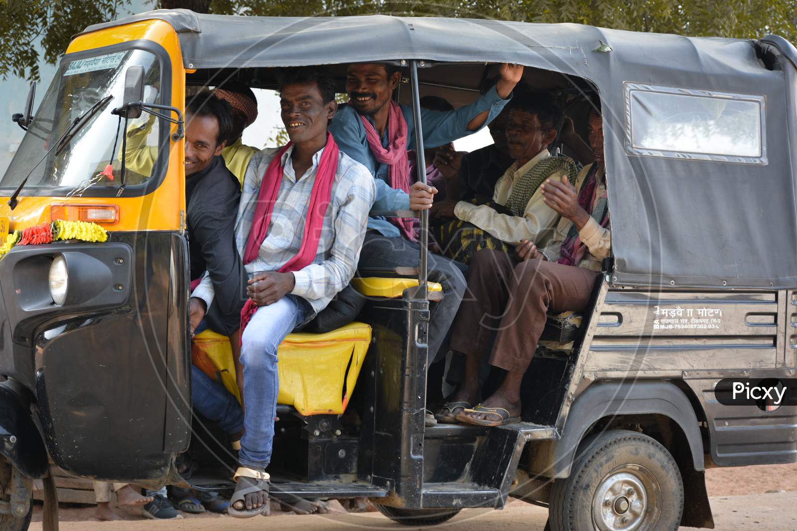 TIKAMGARH, MADHYA PRADESH, INDIA - NOVEMBER 12, 2019: Indian village people sitting together in auto rickshaw.