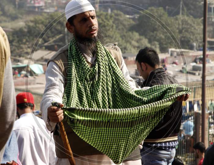 Portrait of a Muslim Man asking for donations