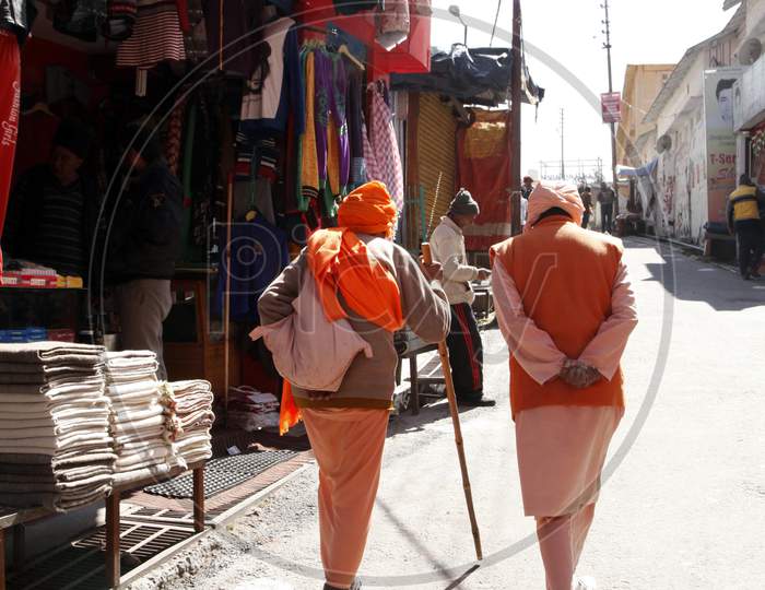 Photograph of a Couple of Old Men's walking