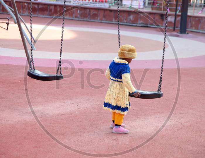 Portrait of an Indian Kid with a Swing