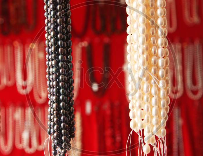 Selective Focus on a Handing Pearls Chains